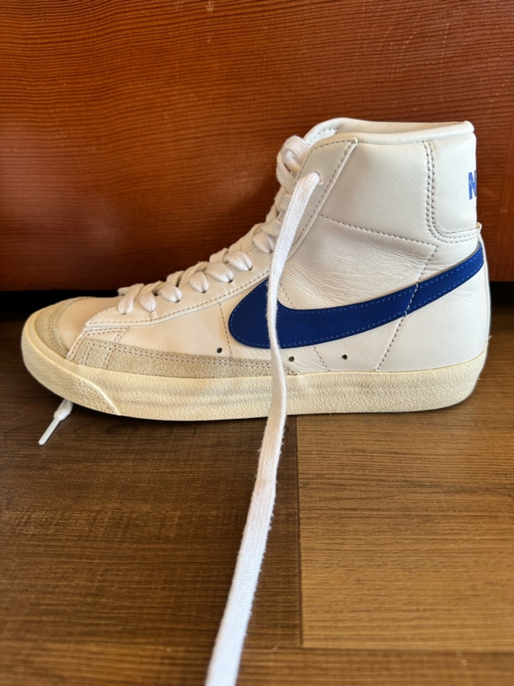 Nike Blazer High-Top Sneaker in White with Blue Swoosh
